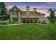Beautiful backyard with spacious lawn, screened porch, and exterior deck at 208 Wilshire Ter, White, GA 30184