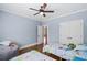 Bright bedroom decorated with hardwood floors, dinosaur themed decor, and a comfortable beanbag for relaxing at 208 Wilshire Ter, White, GA 30184