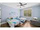 Cozy bedroom designed for with hardwood floors, dinosaur themed decor and a beanbag for relaxing at 208 Wilshire Ter, White, GA 30184