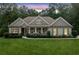 Attractive single Gathering home with nice landscaping and a welcoming front porch at 208 Wilshire Ter, White, GA 30184