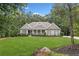 Charming one-story home with a meticulously maintained lawn and classic architectural details at 208 Wilshire Ter, White, GA 30184