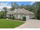 Well-maintained home featuring a side-entry garage and lush landscaping at 208 Wilshire Ter, White, GA 30184