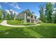 Scenic exterior view showcasing the home's architectural design and landscaping at 208 Wilshire Ter, White, GA 30184