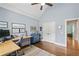 Light and bright home office with hardwood floors, storage cabinet, and charming decor at 208 Wilshire Ter, White, GA 30184