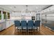 Modern kitchen with stainless steel appliances, large island, and pendant lighting at 208 Wilshire Ter, White, GA 30184