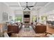 Open living area with coffered ceilings, stone fireplace, and hardwood flooring at 208 Wilshire Ter, White, GA 30184