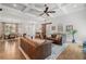 Bright living room with a decorative ceiling, wood floors, and comfortable furnishings at 208 Wilshire Ter, White, GA 30184