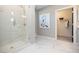 Modern bathroom with glass shower, marble floors, and closet at 392 Pratt Dr # 2014, Atlanta, GA 30315