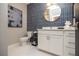 Modern bathroom features elegant mirror, stylish vanity and accent tile at 392 Pratt Dr # 2014, Atlanta, GA 30315
