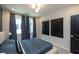 Modern bedroom boasts stylish decor, large window and minimalist art at 392 Pratt Dr # 2014, Atlanta, GA 30315
