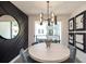 Dining area with round table, unique wall decor, and a view to outdoor balcony at 392 Pratt Dr # 2014, Atlanta, GA 30315