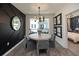 Modern dining room with a round table, stylish decor, and access to an outdoor balcony at 392 Pratt Dr # 2014, Atlanta, GA 30315