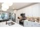 Modern kitchen featuring white cabinets, stainless steel appliances, and a stylish kitchen island at 392 Pratt Dr # 2014, Atlanta, GA 30315