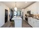 Well-lit kitchen featuring an island with seating, stainless steel appliances, and pendant lighting at 392 Pratt Dr # 2014, Atlanta, GA 30315