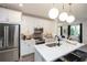 Contemporary kitchen with island, stainless steel appliances, herringbone backsplash, and pendant lighting at 392 Pratt Dr # 2014, Atlanta, GA 30315