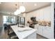 Bright kitchen boasts an island with seating, stainless steel appliances, and a view to the dining area at 392 Pratt Dr # 2014, Atlanta, GA 30315