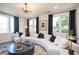 Inviting living room with modern decor, large windows, and stylish lighting at 392 Pratt Dr # 2014, Atlanta, GA 30315