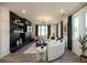 Bright living room features a curved sofa, decorative fireplace, and plenty of natural light at 392 Pratt Dr # 2014, Atlanta, GA 30315