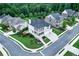 Aerial view of a brick home with a manicured lawn and pristine landscaping at 4503 Atley Woods Se Dr, Atlanta, GA 30339