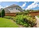 Landscaped backyard featuring a healthy garden, privacy fence, and well-maintained lawn at 4503 Atley Woods Se Dr, Atlanta, GA 30339