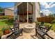 Spacious backyard with outdoor kitchen, brick fire pit with seating and beautiful landscaping at 4503 Atley Woods Se Dr, Atlanta, GA 30339
