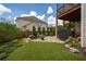 Outdoor living area with a patio, chairs, grill, and a manicured lawn at 4503 Atley Woods Se Dr, Atlanta, GA 30339
