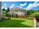 Expansive backyard features well-maintained lawn, mature trees and privacy fence at 4503 Atley Woods Se Dr, Atlanta, GA 30339