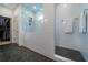 An elegant bathroom shows a glass shower with storage and an adjacent walk-in closet at 4503 Atley Woods Se Dr, Atlanta, GA 30339