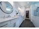 Modern bathroom featuring double sinks, quartz countertops and a glass shower at 4503 Atley Woods Se Dr, Atlanta, GA 30339