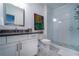 Modern bathroom with a white vanity, a gray countertop, and a glass-enclosed shower with stylish fixtures at 4503 Atley Woods Se Dr, Atlanta, GA 30339