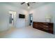 Spacious bedroom with sleek, dark wood dresser, and a modern ceiling fan, creating a relaxing space at 4503 Atley Woods Se Dr, Atlanta, GA 30339