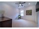 Bright bedroom with neutral walls, carpet and an artful decor, illuminated by a ceiling fan at 4503 Atley Woods Se Dr, Atlanta, GA 30339