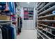 Spacious walk-in closet features custom shelving, hanging rods, and plenty of storage for clothes and shoes at 4503 Atley Woods Se Dr, Atlanta, GA 30339