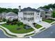 Beautiful two-story brick home featuring dual porches, manicured lawn, attached garage, and professional landscaping at 4503 Atley Woods Se Dr, Atlanta, GA 30339
