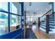 Inviting foyer with hardwood floors, staircase, and open view to living room, flooded with natural light at 4503 Atley Woods Se Dr, Atlanta, GA 30339