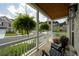 Inviting front porch with hanging ferns and comfortable seating. View of street and neighborhood at 4503 Atley Woods Se Dr, Atlanta, GA 30339