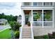 Charming front porch with brick floor, hanging plants, and view of the walkway at 4503 Atley Woods Se Dr, Atlanta, GA 30339