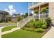 Charming porch featuring vibrant landscaping, stylish railing, and brick steps leading to the beautiful white porch at 4503 Atley Woods Se Dr, Atlanta, GA 30339