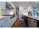 Bright kitchen featuring stainless appliances, gas range, an island, and ample counter space at 4503 Atley Woods Se Dr, Atlanta, GA 30339