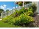Landscaped front yard with colorful flowers and manicured shrubs enhances the curb appeal of this lovely home at 4503 Atley Woods Se Dr, Atlanta, GA 30339