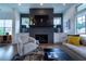 Charming living room with a gray fireplace, white built-ins, and stylish decor at 4503 Atley Woods Se Dr, Atlanta, GA 30339