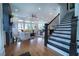 An open living area shows a fireplace, large windows, and staircase to upper level at 4503 Atley Woods Se Dr, Atlanta, GA 30339