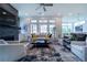 Comfortable living room with a modern fireplace, large windows, and ample seating, perfect for entertaining at 4503 Atley Woods Se Dr, Atlanta, GA 30339