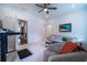 Bright living room featuring a comfortable seating area and a stylish workspace with modern adjustable desk at 4503 Atley Woods Se Dr, Atlanta, GA 30339