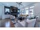 Inviting living room featuring a fireplace, a flat screen television, and large windows at 4503 Atley Woods Se Dr, Atlanta, GA 30339
