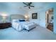 Bright primary bedroom with cozy sitting area and serene decor at 4503 Atley Woods Se Dr, Atlanta, GA 30339
