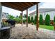 Covered patio featuring a stone paver floor, an outdoor grill, and seating with a view of the backyard at 4503 Atley Woods Se Dr, Atlanta, GA 30339