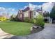 Expansive backyard featuring lush lawn, mature trees, and a patio area at 821 Camden Park Ct, Atlanta, GA 30342