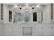 Elegant bathroom with double vanity, marble countertops, and large mirrors at 821 Camden Park Ct, Atlanta, GA 30342