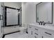 Modern bathroom featuring a marble countertop, classic fixtures, and tiled shower at 821 Camden Park Ct, Atlanta, GA 30342